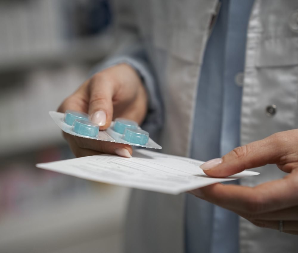 female-pharmacist-with-pills-medicine